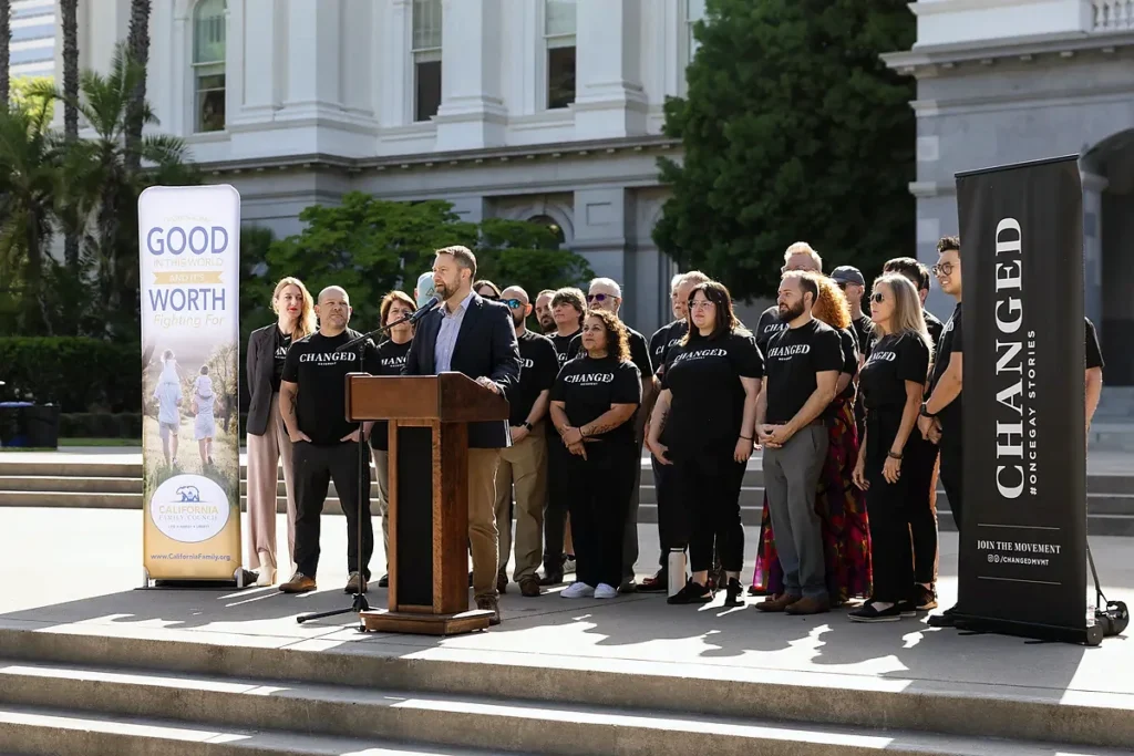 Jonathan R. Keller speaks on the State Capitol steps at the 2025 Changed rally