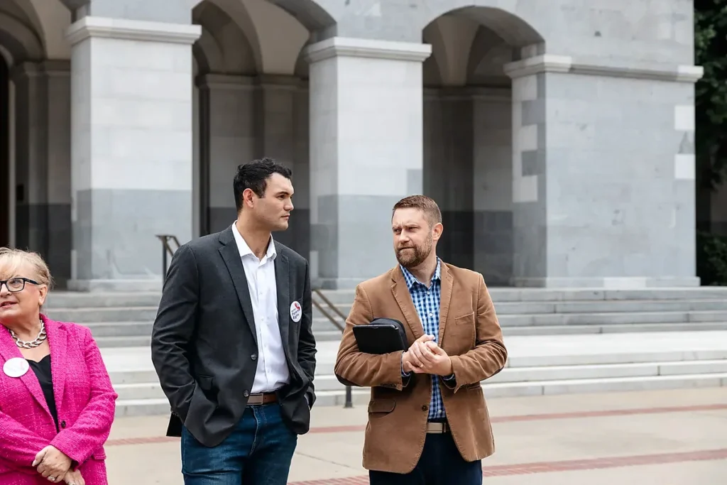 Jonathan R. Keller talks with advocates outside the California State Capitol during the 2023 Lobby Day for Parental Rights