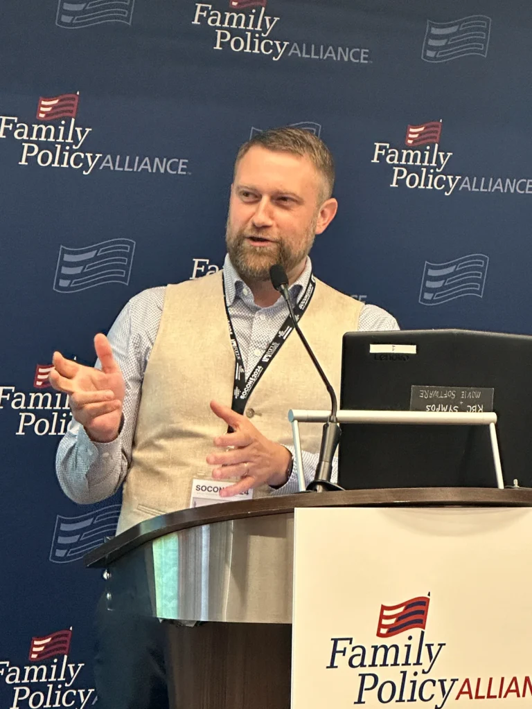 Jonathan Keller speaks at a Family Policy Alliance podium in 2024.