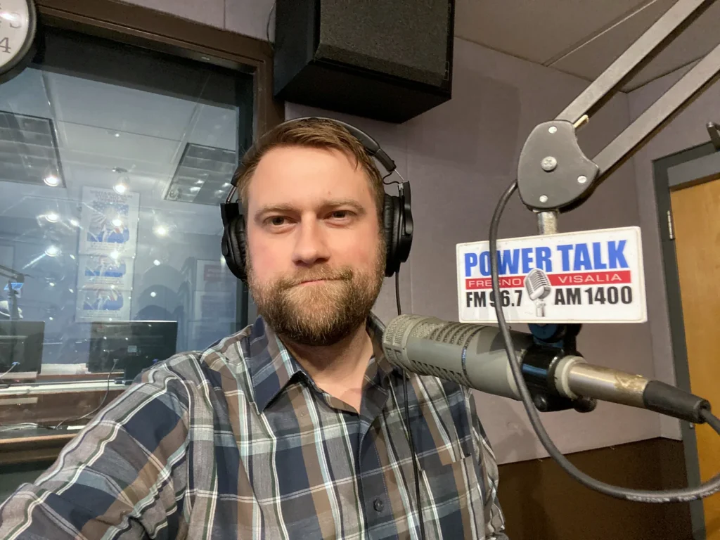Jonathan Keller in a radio studio at Power Talk 96.7 FM and AM 1400 in Fresno.