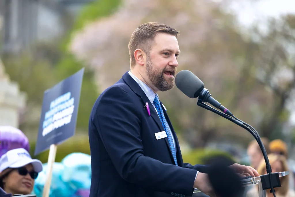 Jonathan Keller speaks at a microphone outside the U.S. Supreme Court in 2025.