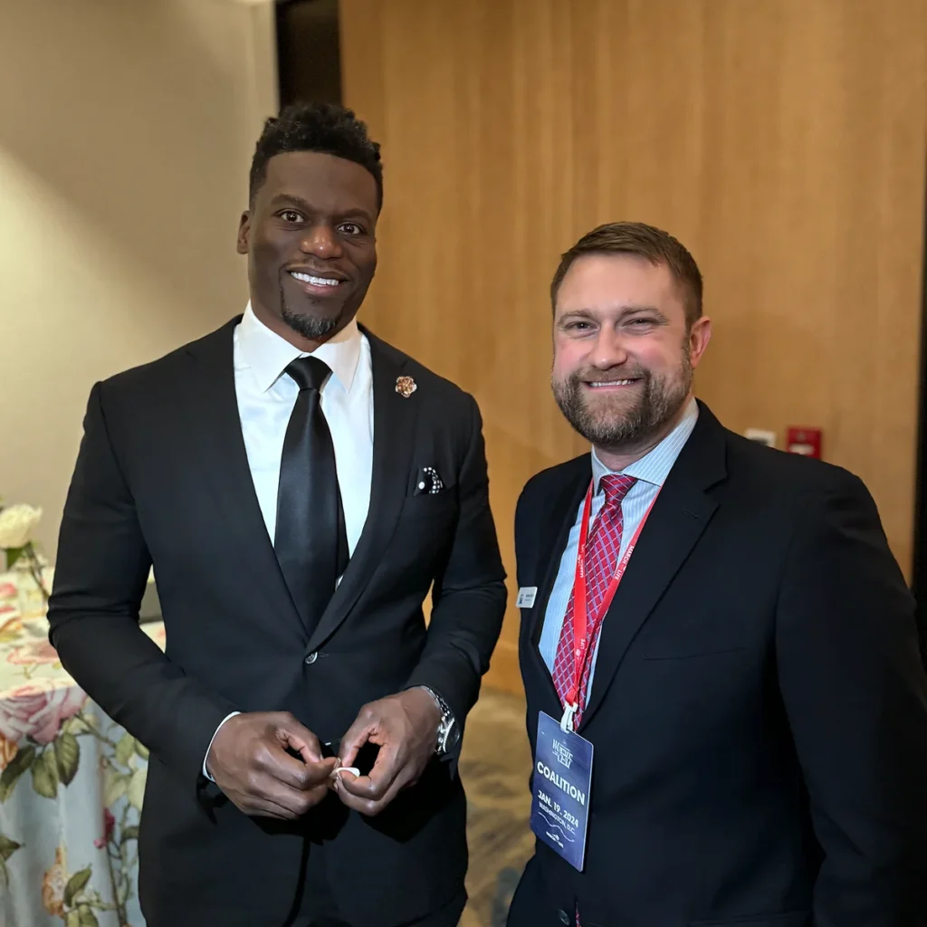 Jonathan Keller with Benjamin Watson in 2024.